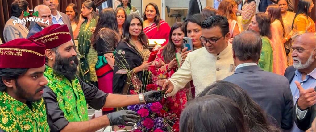 Mr.Paanwala team serving handcrafted premium paan to guests at a grand wedding reception with live paan catering services.