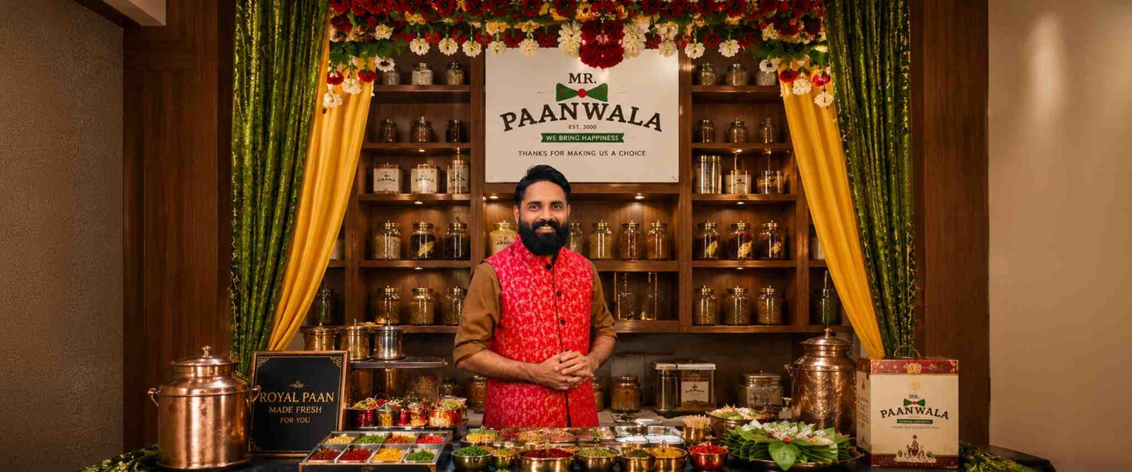 Mr.Paanwala founder presenting a traditional paan counter with ingredients and products.