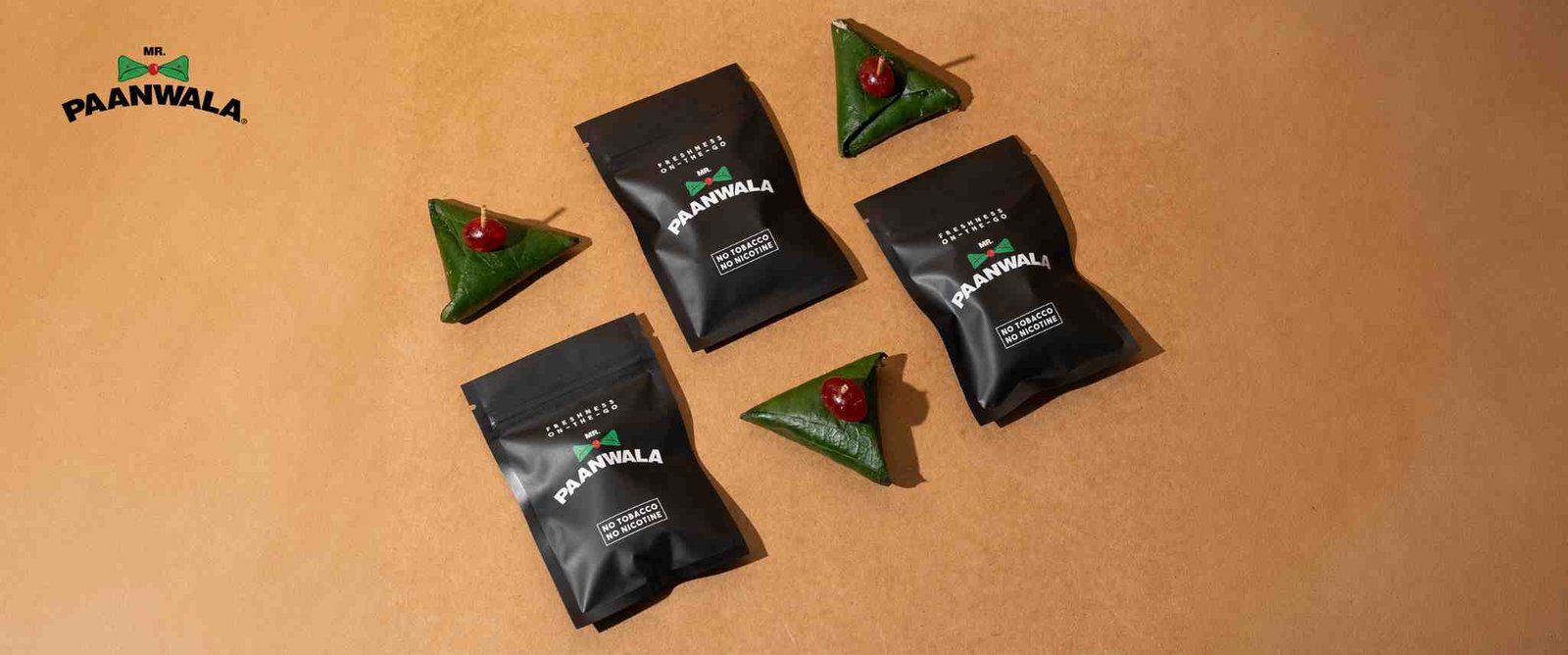 Packaged paan products and fresh paan servings for events.