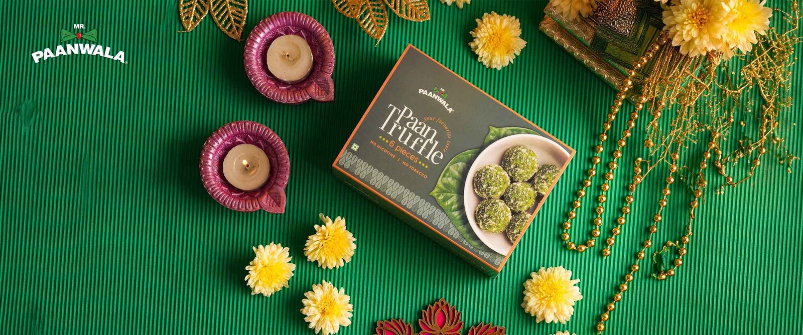 Mr. Paanwala Paan Truffle gift box arranged with festive Diwali decorations and candles.