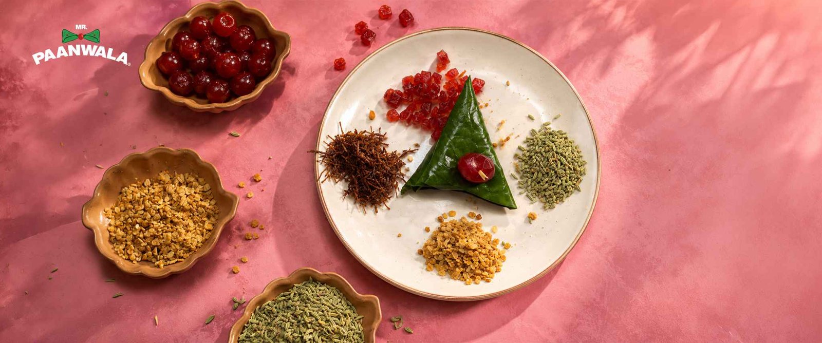 Betel leaf paan with cooling ingredients and spices, presented with fresh ingredients.